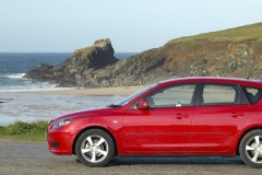 Red Mazda 3 2003 hatchback side